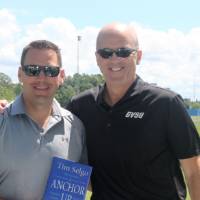 2 men outside posing for pic